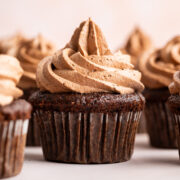 rich chocolate cupcake topped with a tall swirl of chocolate buttercream.