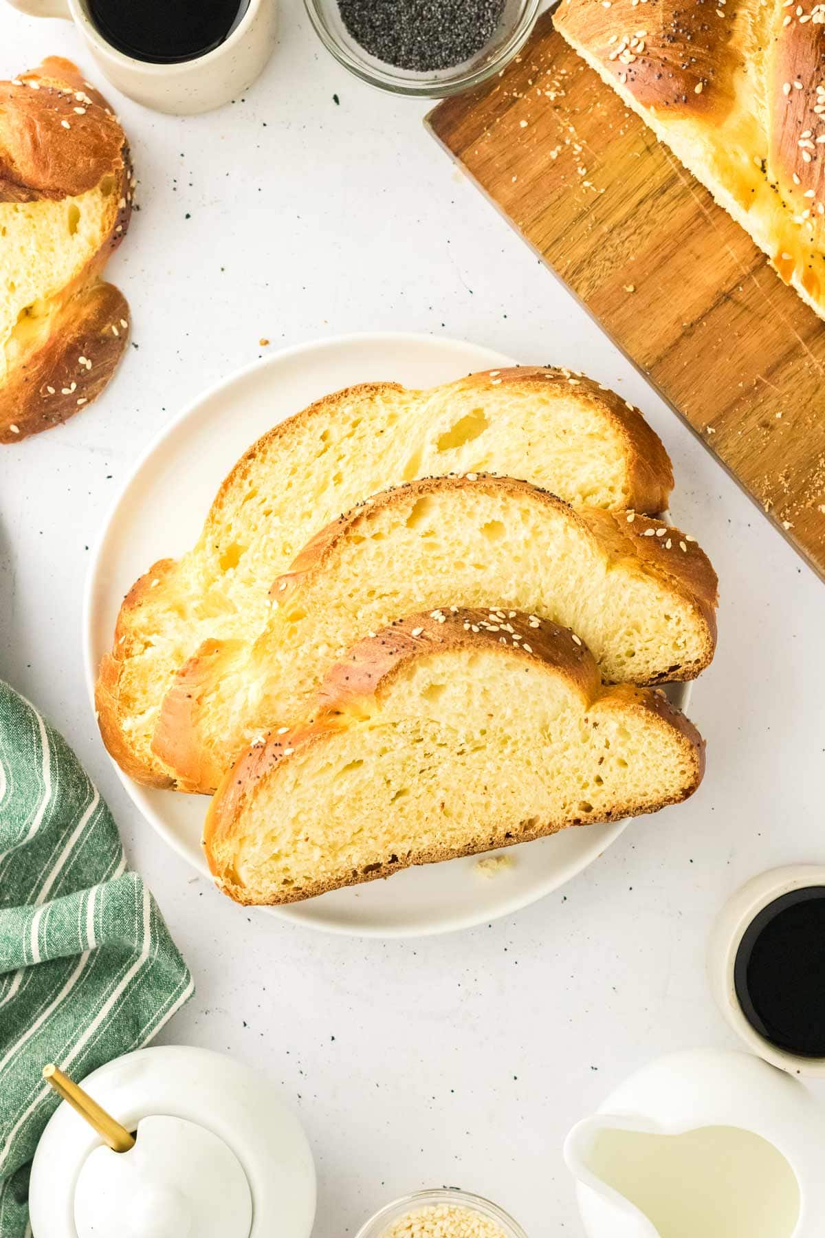 three slices of challah on a plate.