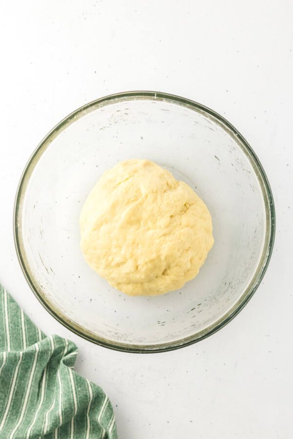 kneaded challah dough in a mixing bowl prior to first rise