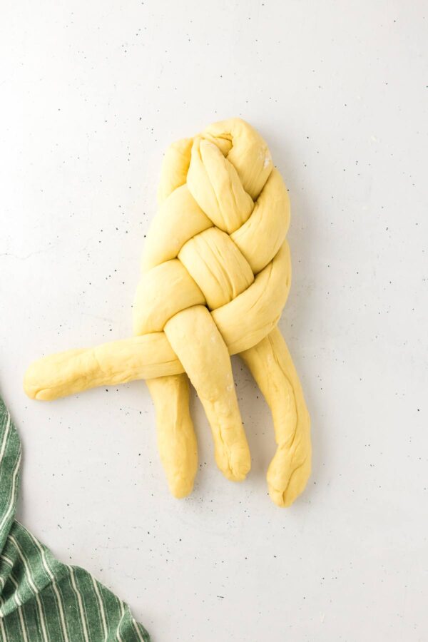 braiding a four-strand challah.
