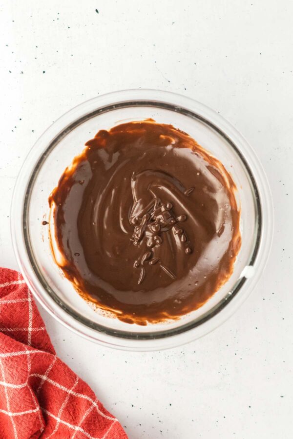 silky smooth chocolate ganache in a glass bowl.