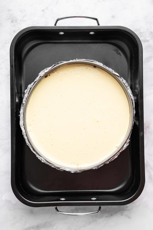 unbaked cheesecake in a waterbath.