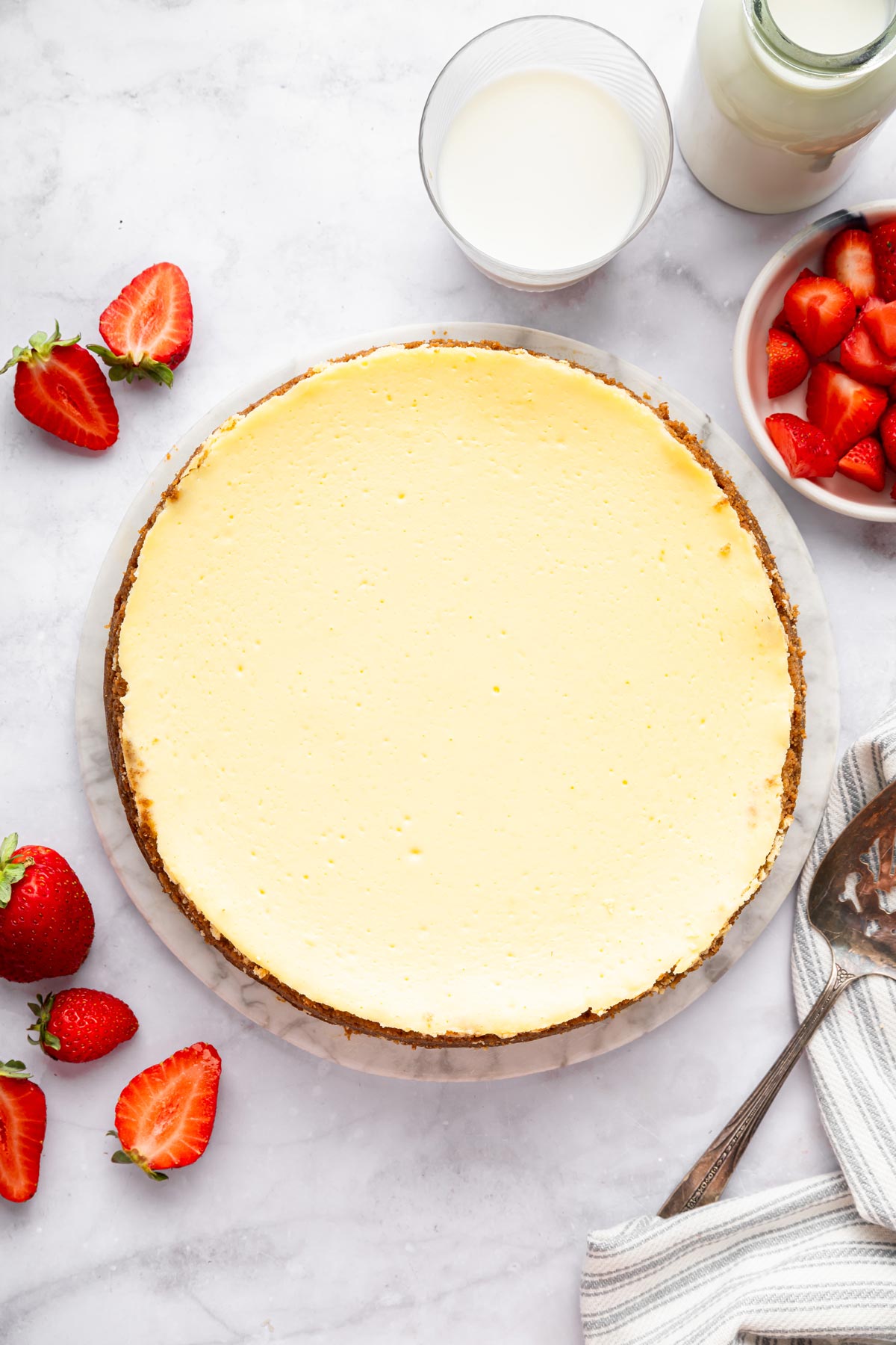 classic new york style cheesecake with a graham cracker crust.
