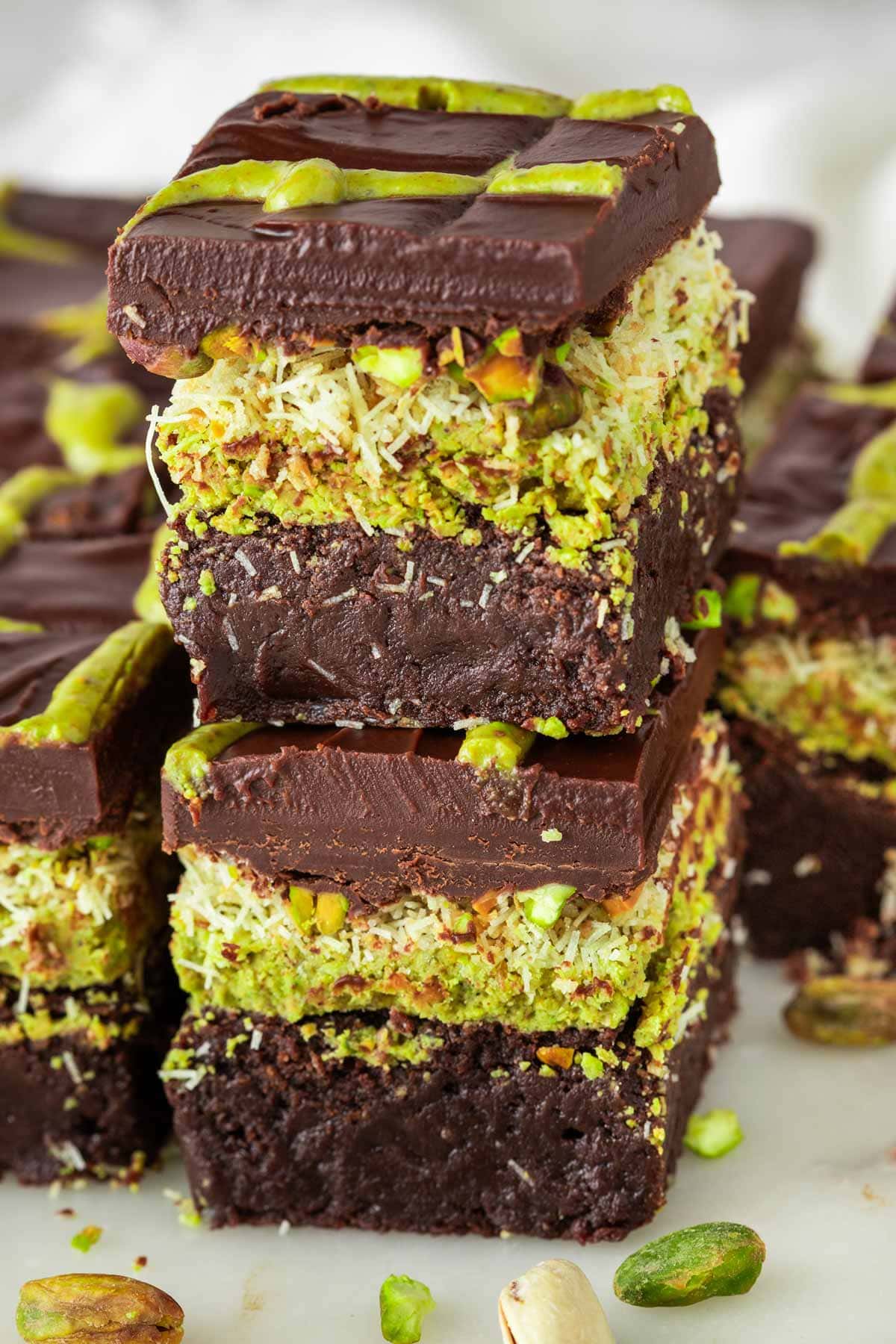 two thick dubai chocolate brownies stacked on top of each other.