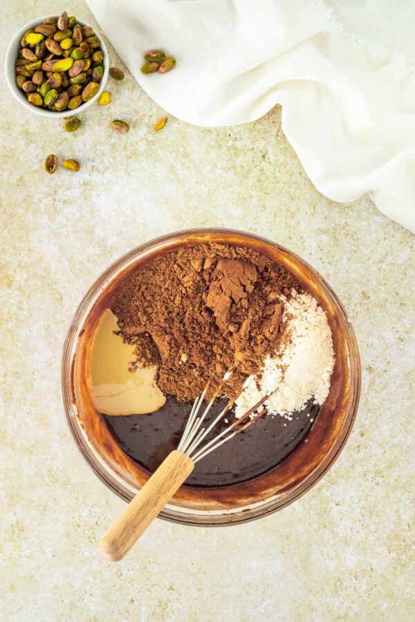 stirring flour and cocoa powder into brownie batter.