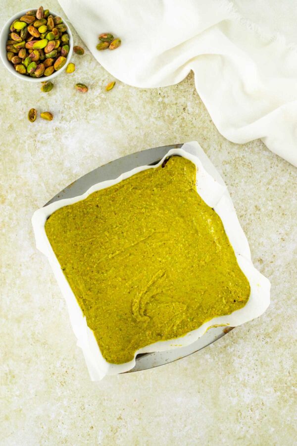 homemade pistachio cream layered on top of brownies.