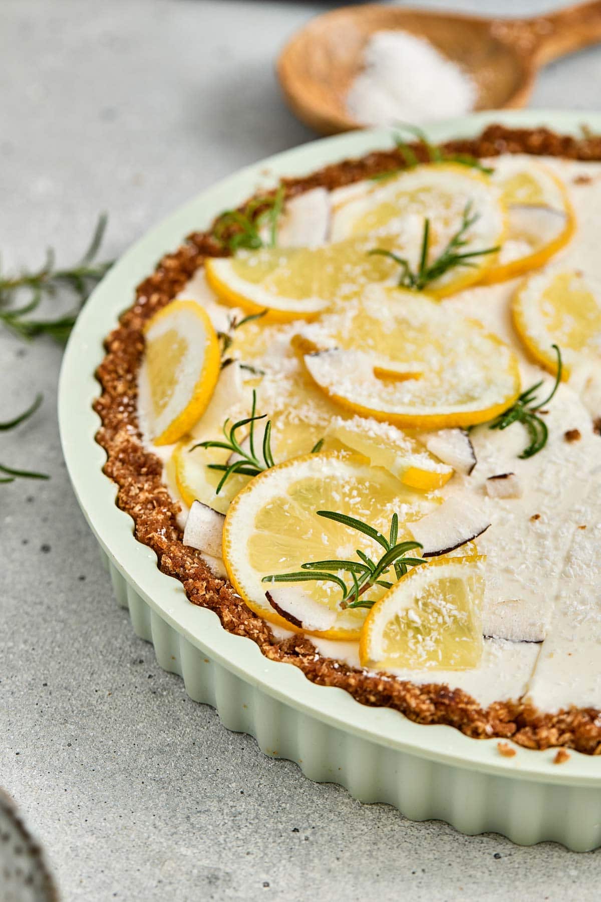 side view of thinly sliced lemons topping a no bake tart.