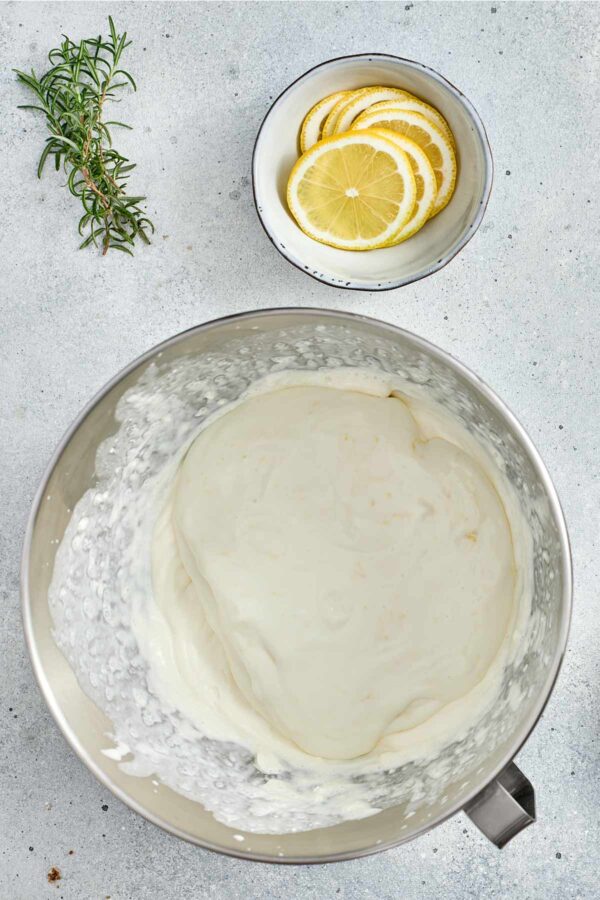 adding whipped cream to the lemon cream cheese filling.