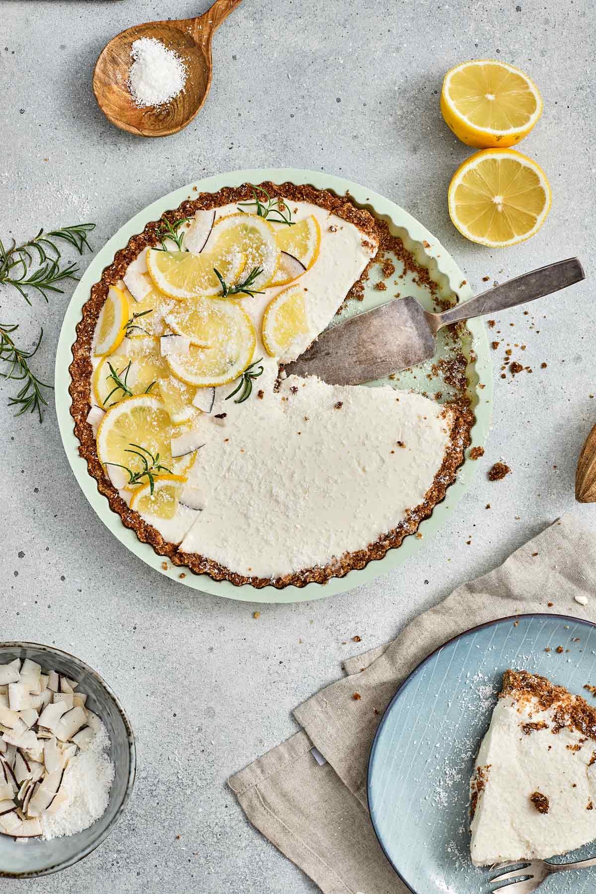 lemon coconut tart with one slice removed.