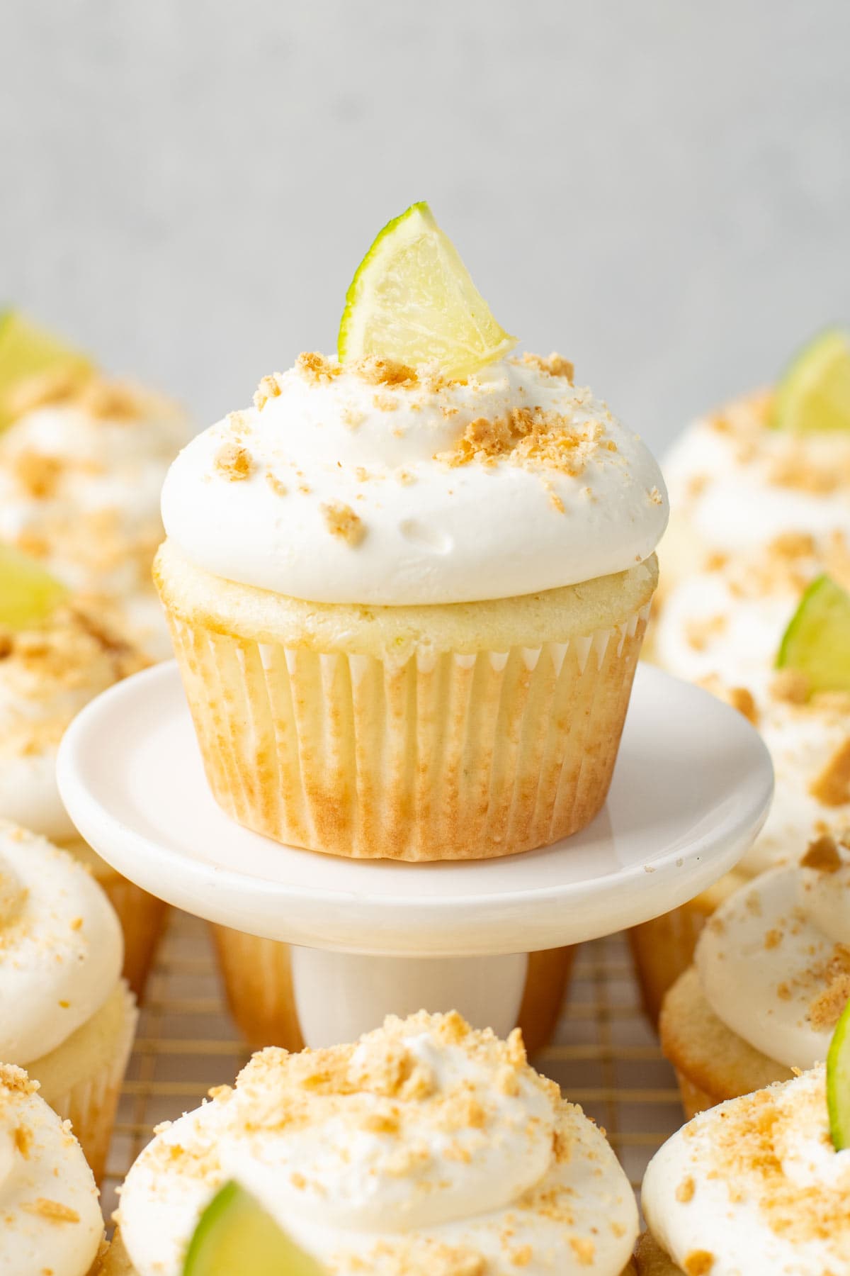 side view of a cupcake with fluffy whipped cream frosting.