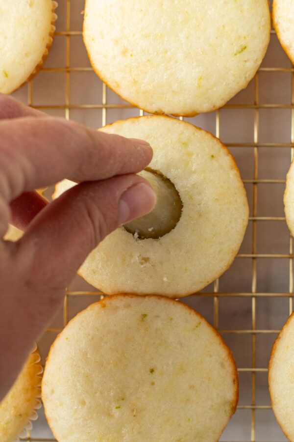 coring cupcakes using a piping tip.