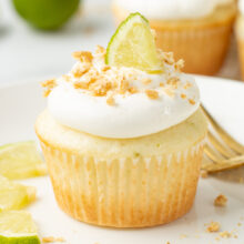 key lime pie cupcake topped with fluffy whipped cream frosting.