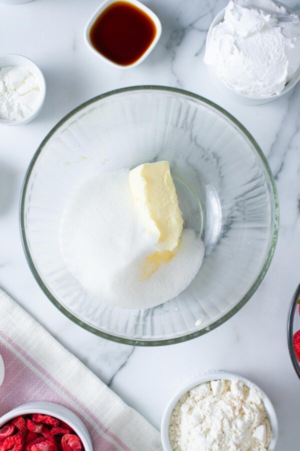 butter and sugar in a glass mixing bowl.