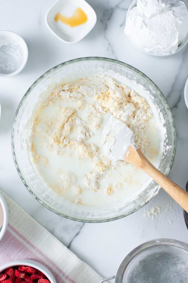 alternating milk and dry ingredients in vanilla cake batter.