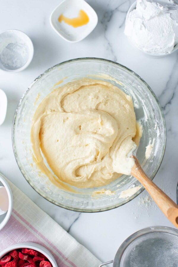smooth vanilla cupcake batter in a mixing bowl.