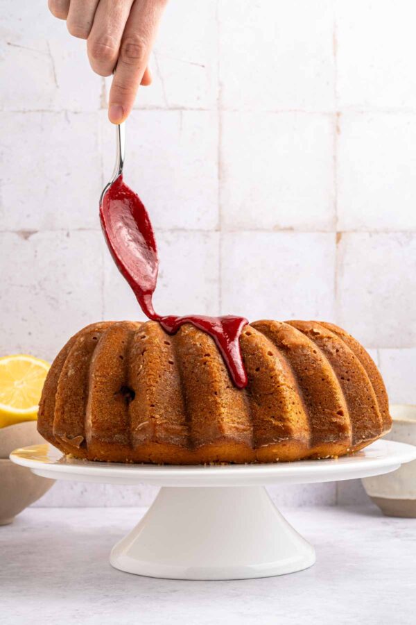 drizzling blackberry glaze over a bundt cake.