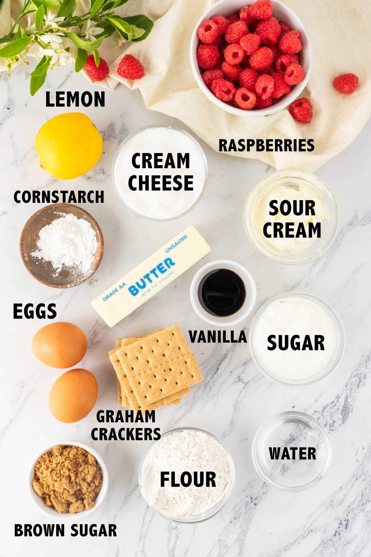 overhead view of ingredients used to make lemon raspberry cheesecake bars.