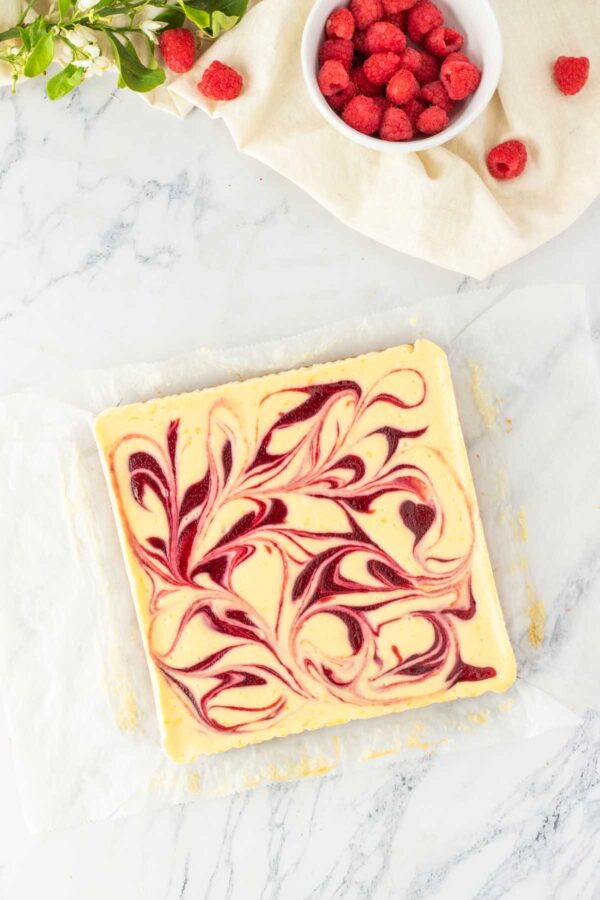 swirled lemon raspberry cheesecake bars after baking.
