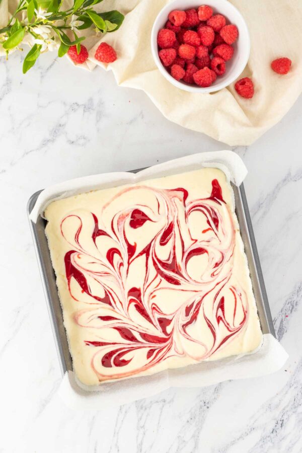 swirled lemon raspberry cheesecake bars before baking.