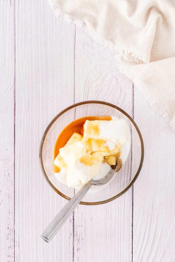 mixing together honey and cream cheese.