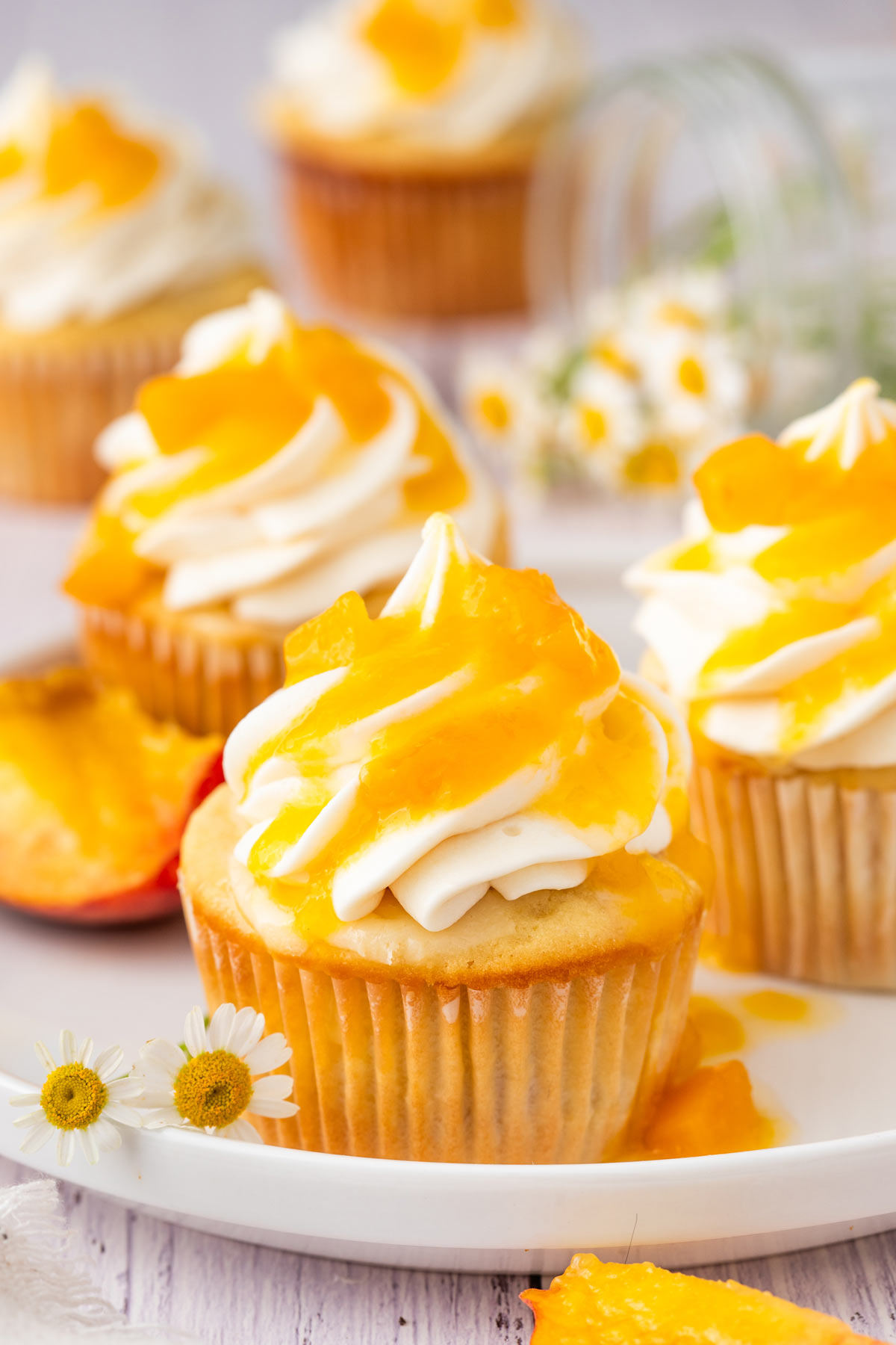 peach cupcakes topped with a thick peach glaze.