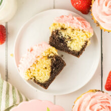 neapolitan cupcakes with chocolate and vanilla cupcake layers and strawberry buttercream.