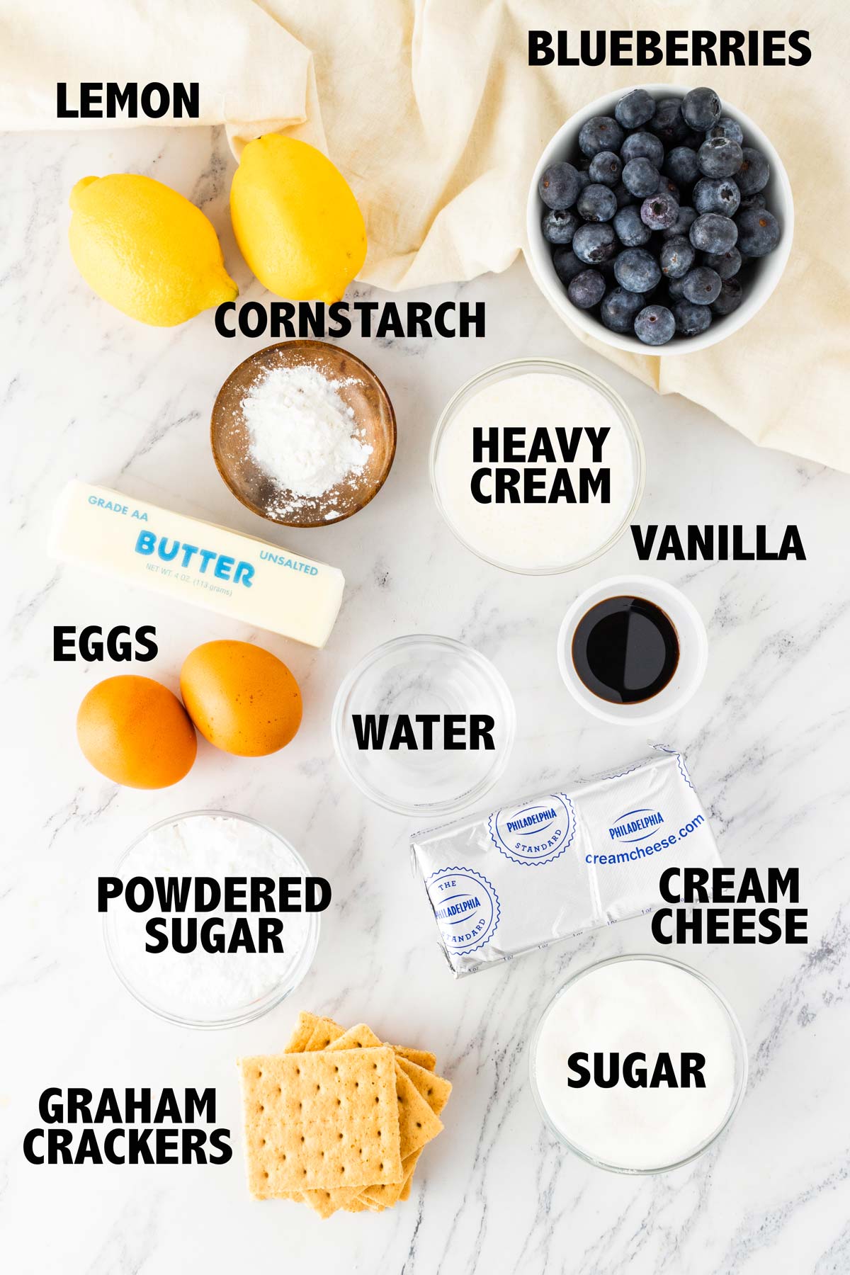 overhead view of ingredients used to make no bake lemon blueberry cheesecake.