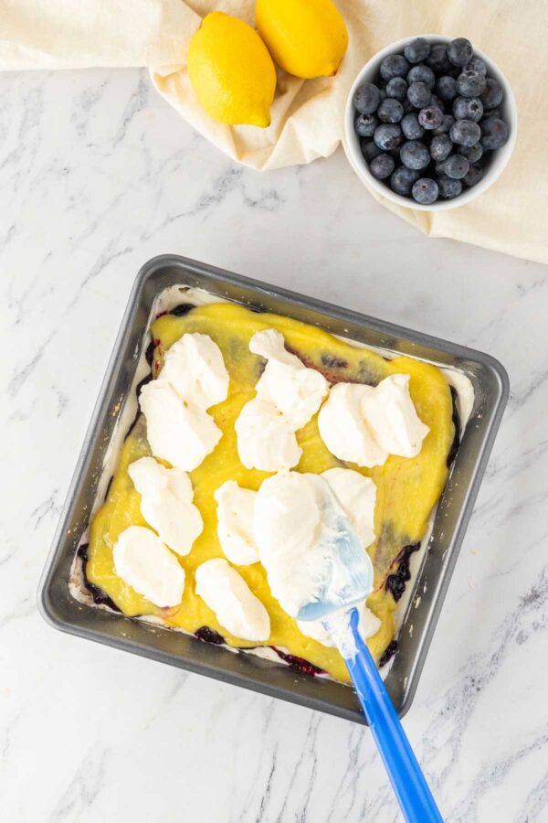 layer of whipped cream on a no bake cheesecake.