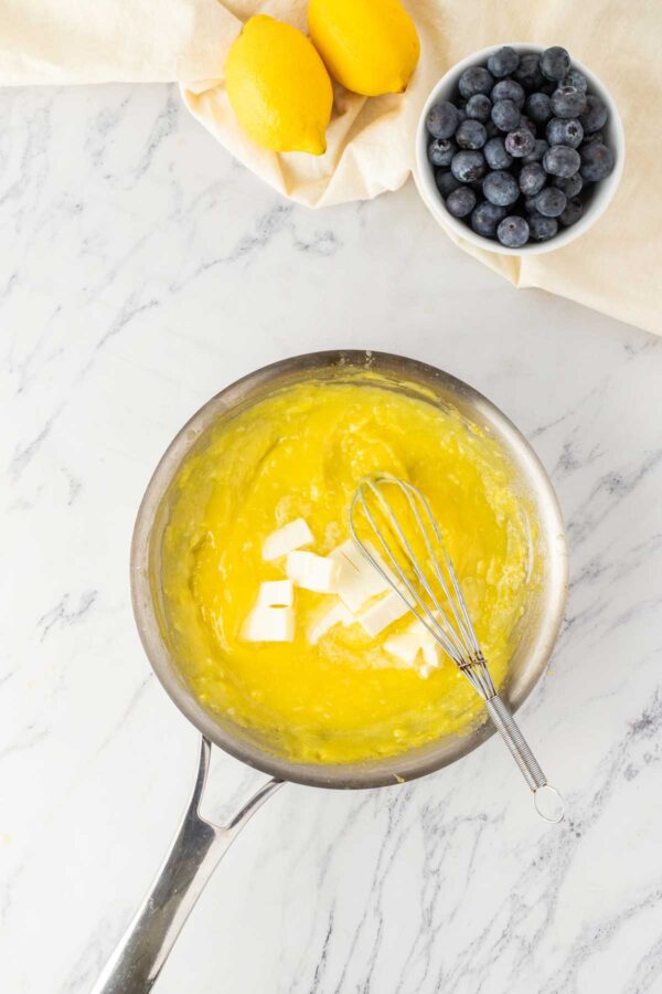 stirring butter into lemon curd.