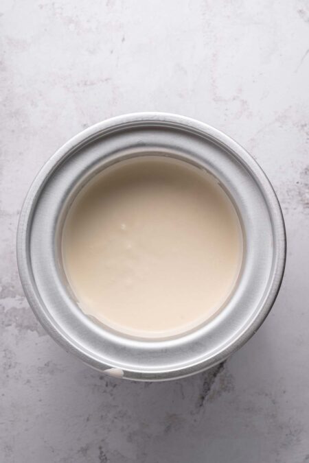 vanilla ice cream base churning in a home ice cream machine.