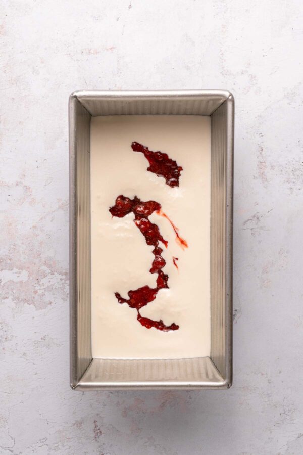 vanilla ice cream with swirls of strawberry puree.