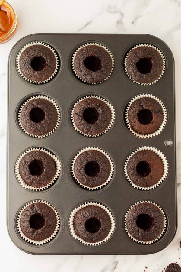 chocolate cupcakes cored to make a hole in the center.
