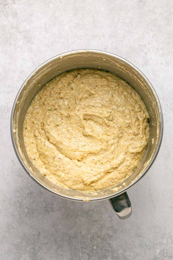 pistachio bundt cake batter in a mixing bowl.