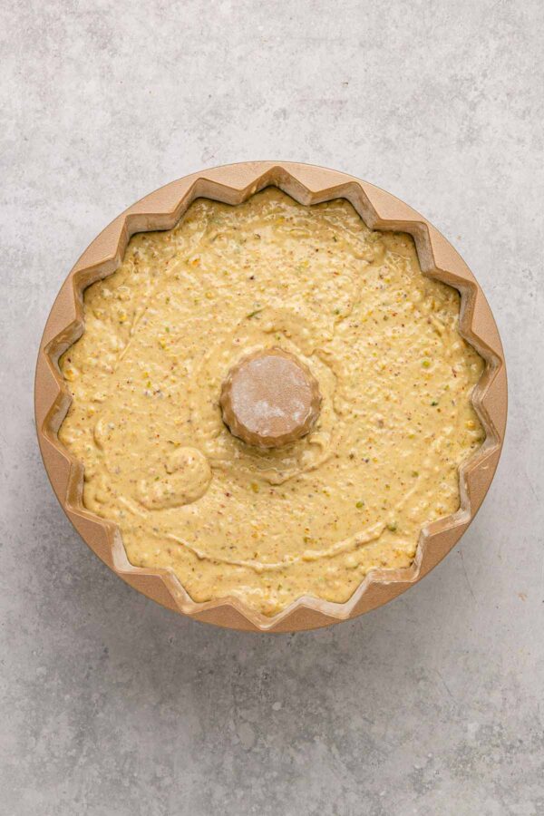 pistachio cake batter in a bundt cake.