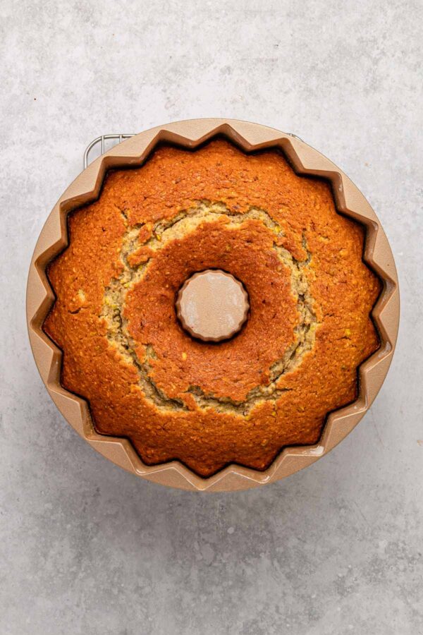 freshly baked pistachio bundt cake still in the pan.