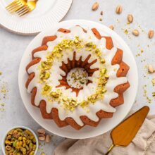 overhead view of a pistachio bundt cake with a thick glaze.