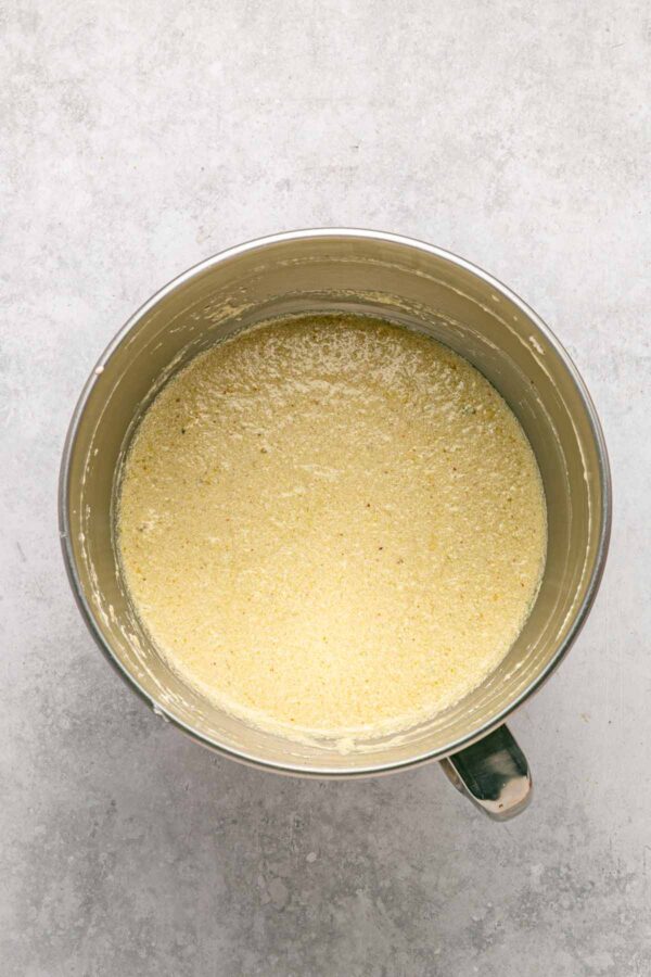 pistachio bundt cake batter in a mixing bowl.