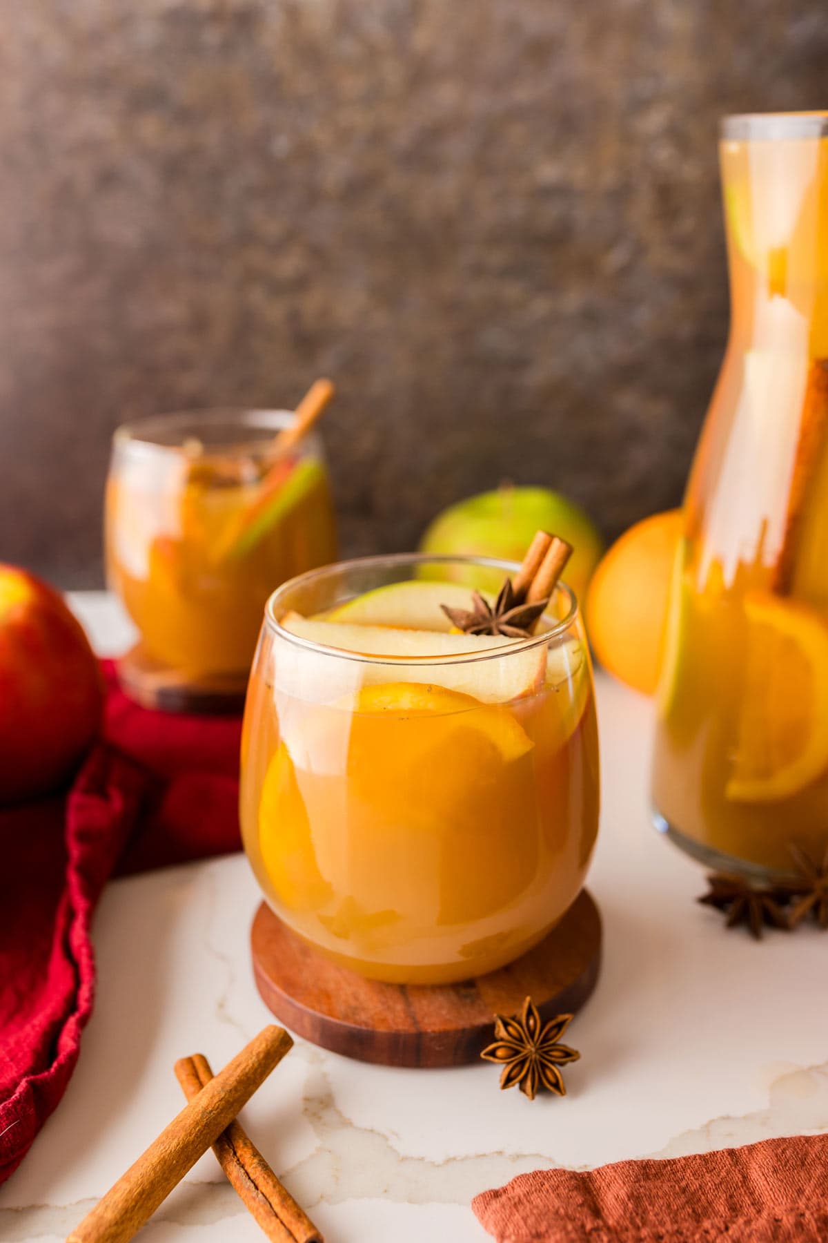 fall sangria surrounded by cinnamon sticks and star anise.