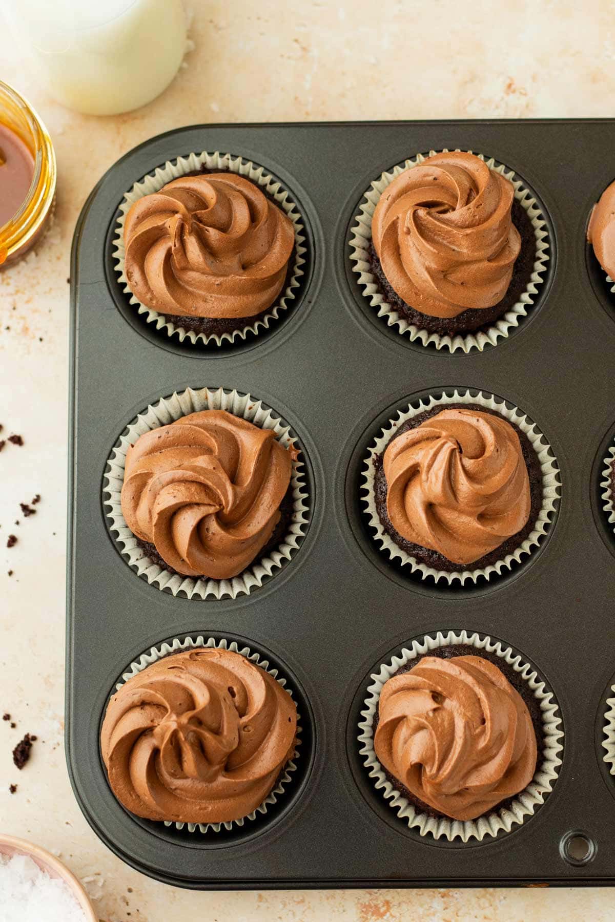 caramel filled chocolate cupcakes frosted with generous swirls of whipped ganache.