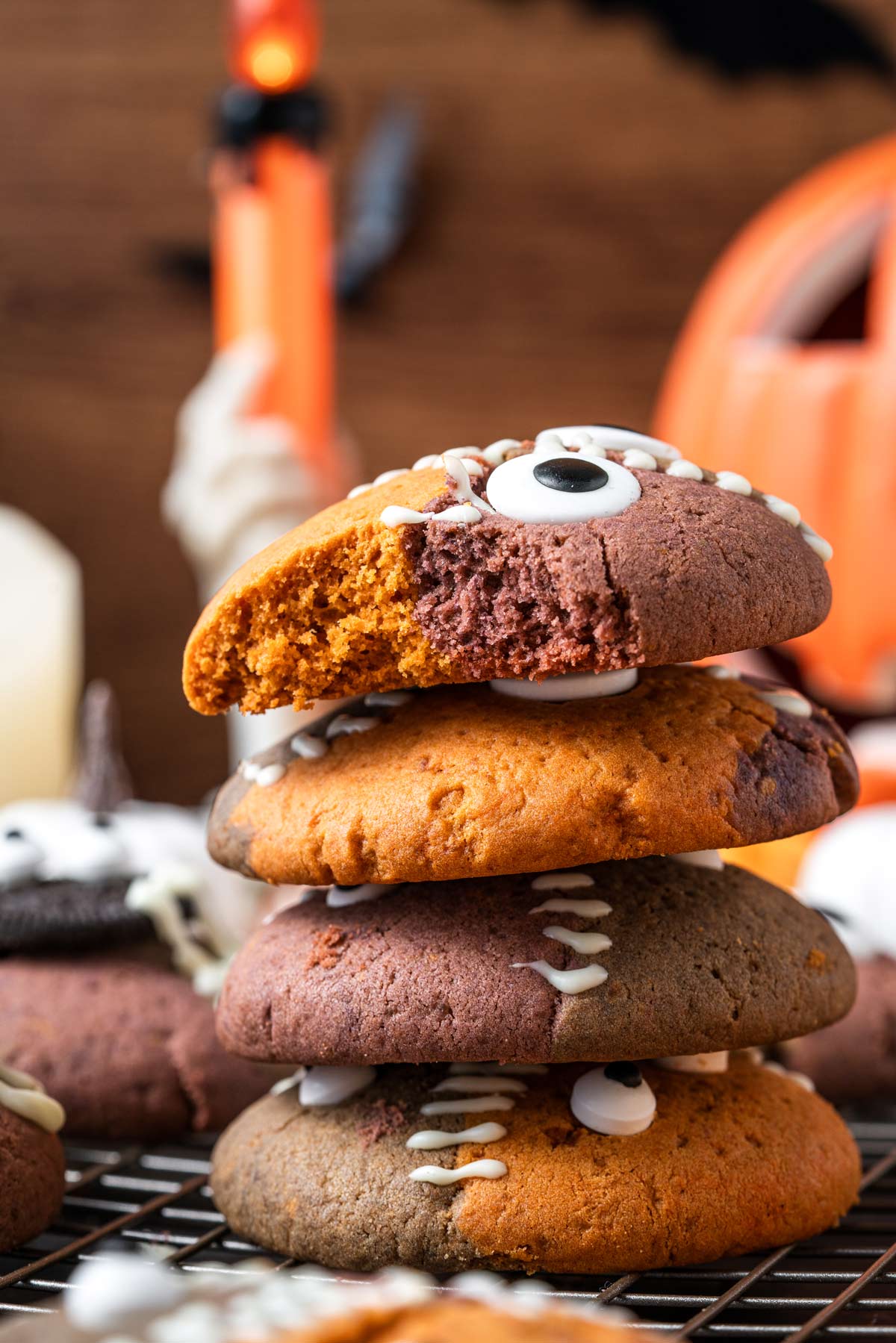 stack of thick cookies with a bite taken out, showing the thick and chewy interior.