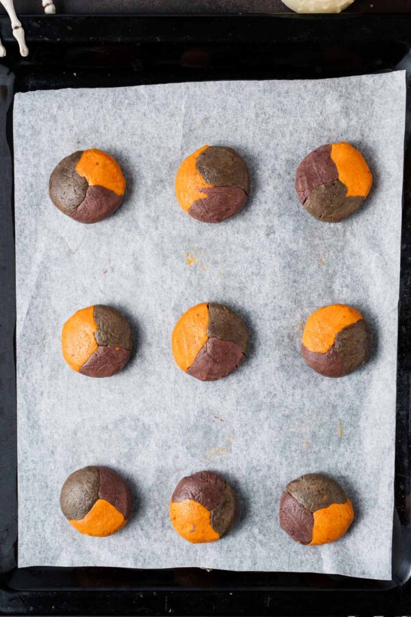 tri-colored cookies on a sheet before baking.