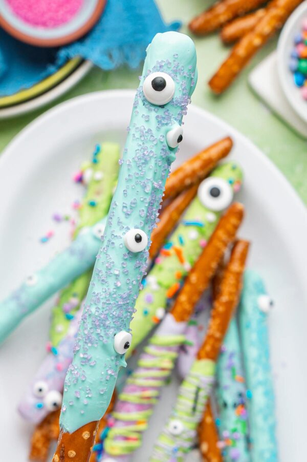 monster pretzel rod decorated with candy eyeballs and sanding sugar.