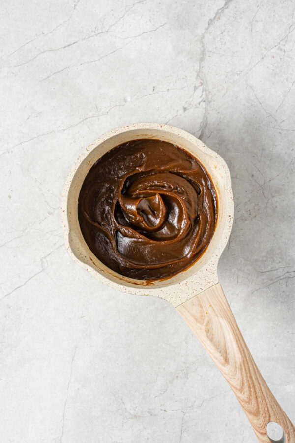 cooking down homemade pumpkin butter until thick.